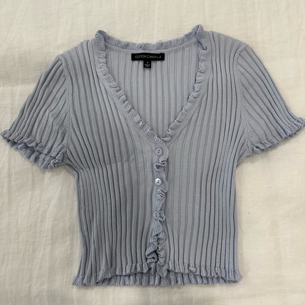 Isabelle’s Cabinet blue knit top